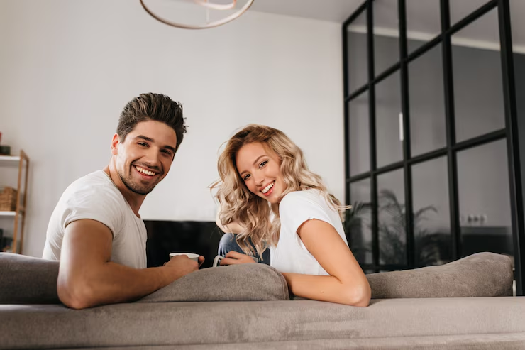 A couple sitting on a sofa
