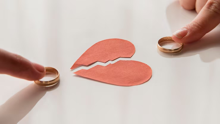 Two people holding rings
