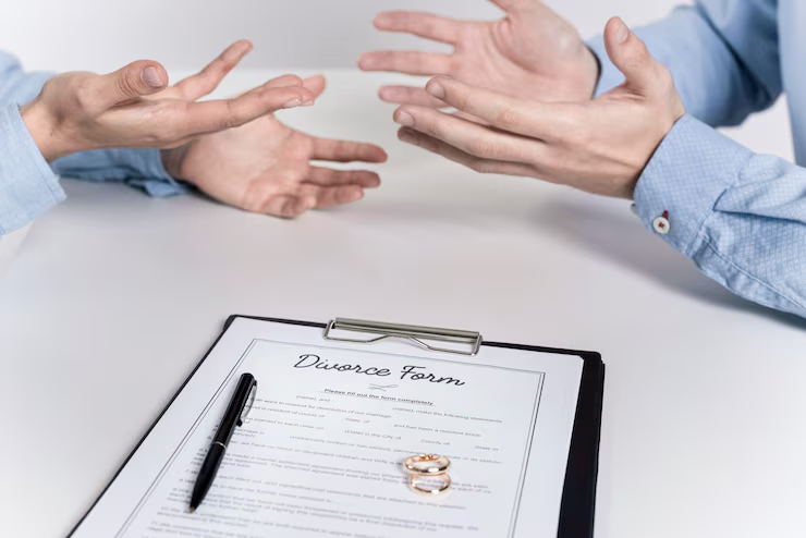 A divorce form and two rings