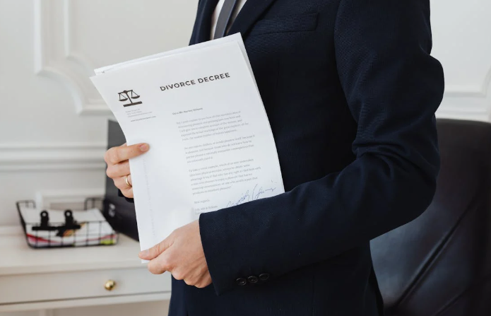 Person holding a divorce decree