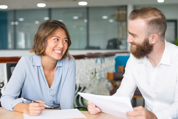 A couple holding documents