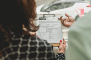 a lawyer and a couple going through property papers for property division