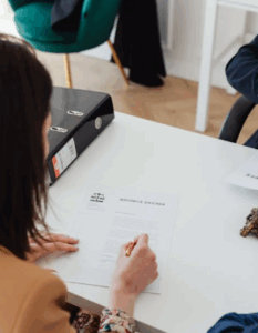 Woman signing divorce papers