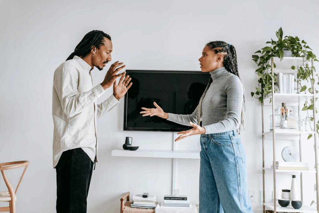 A couple fighting and visibly frustrated during their divorce, suggesting possible asset hiding issues