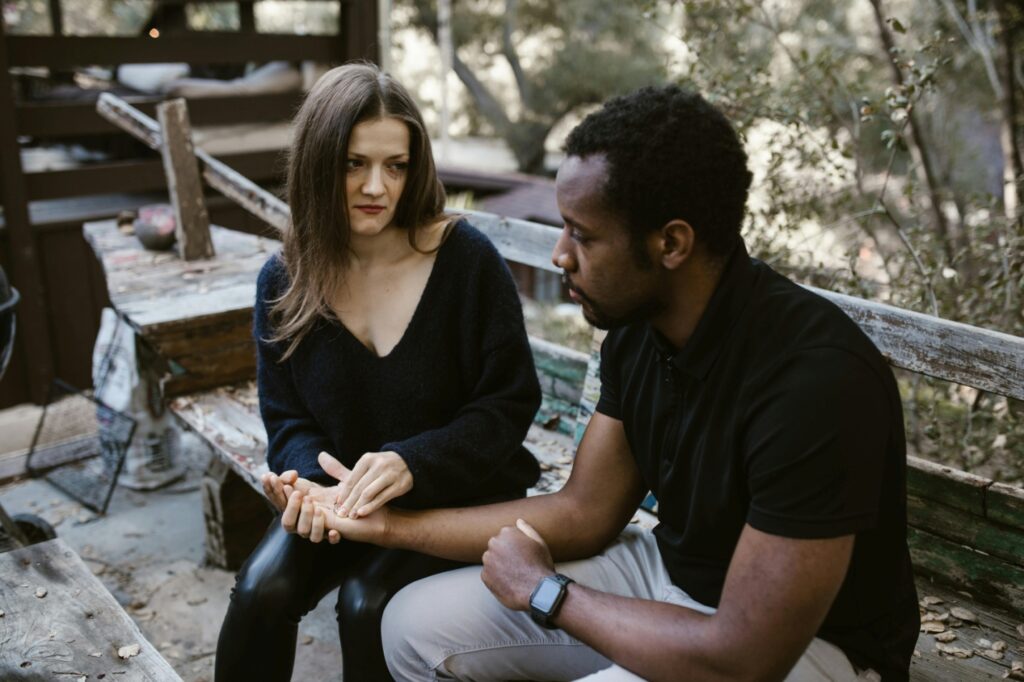 A couple sitting on a bench