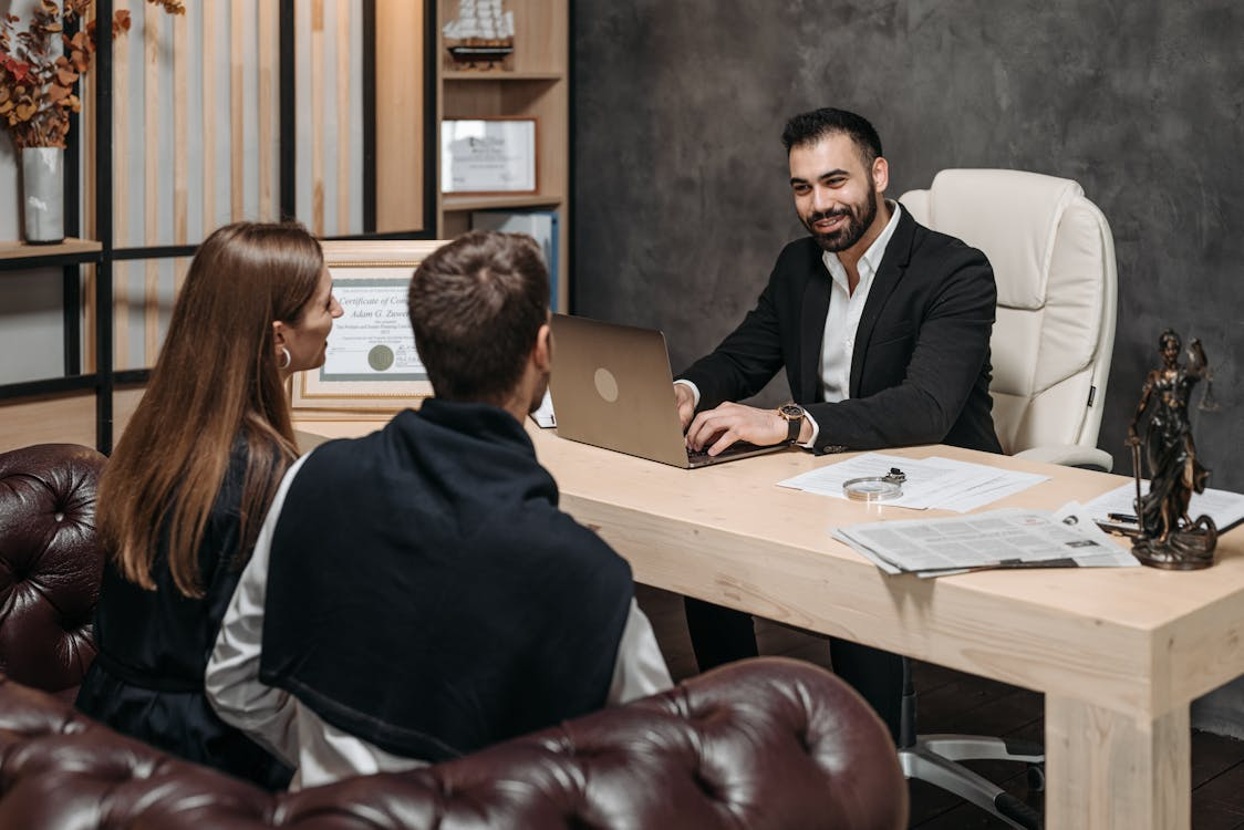 A lawyer talking to a couple