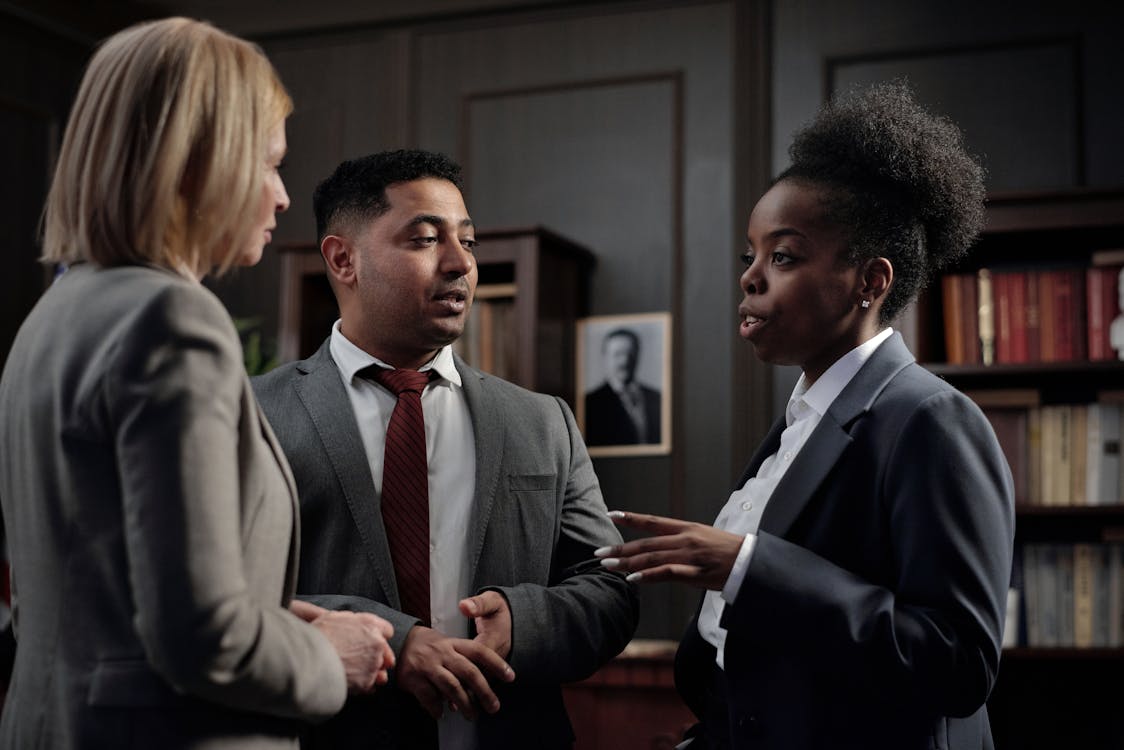 Property division lawyer in Conroe engaged in a professional discussion at a law office.