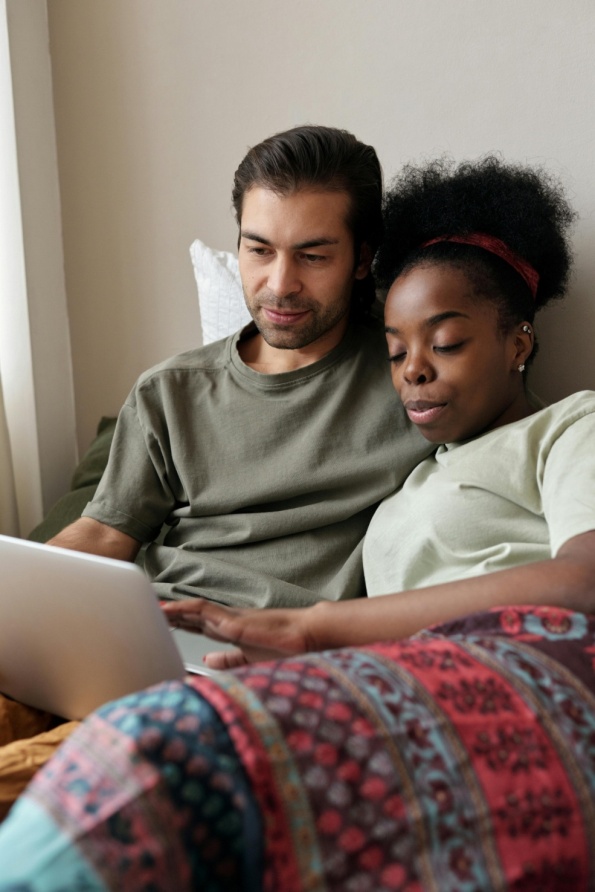 A couple looking at a laptop