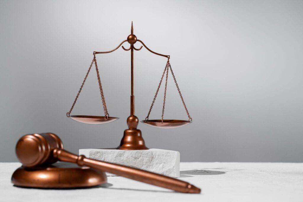 The scales of justice and a judge’s gavel