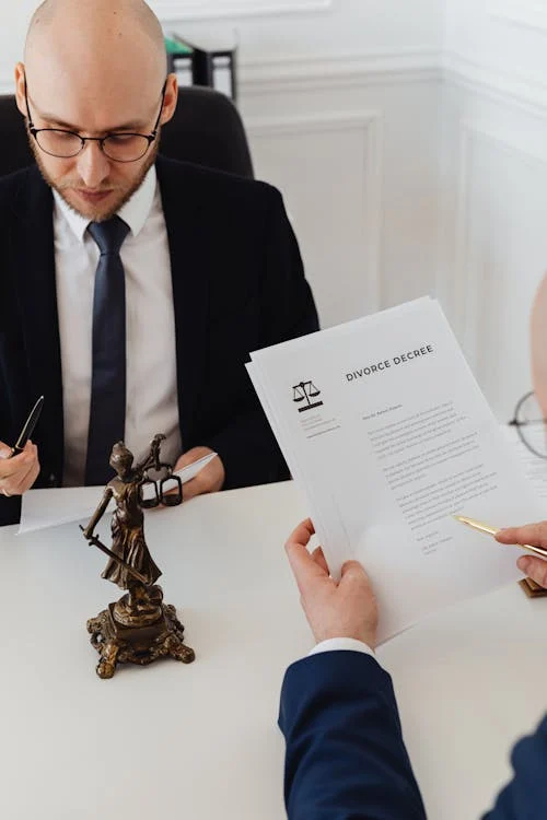 Lawyer and client discussing divorce papers