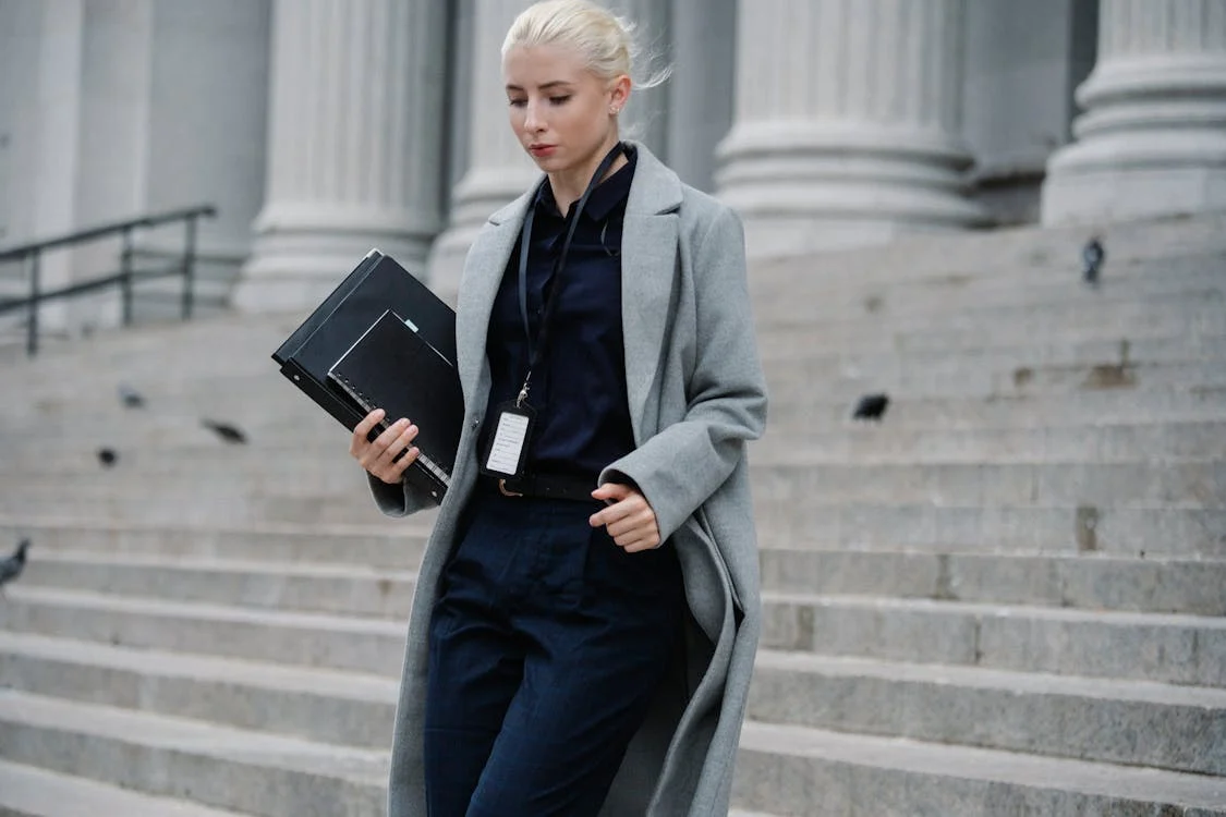 Lawyer walking down the stairs at the courthouse.
