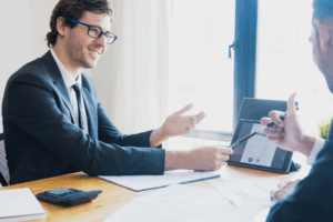 An attorney discussing case details with a client, highlighting the importance of a Houston divorce law firm.