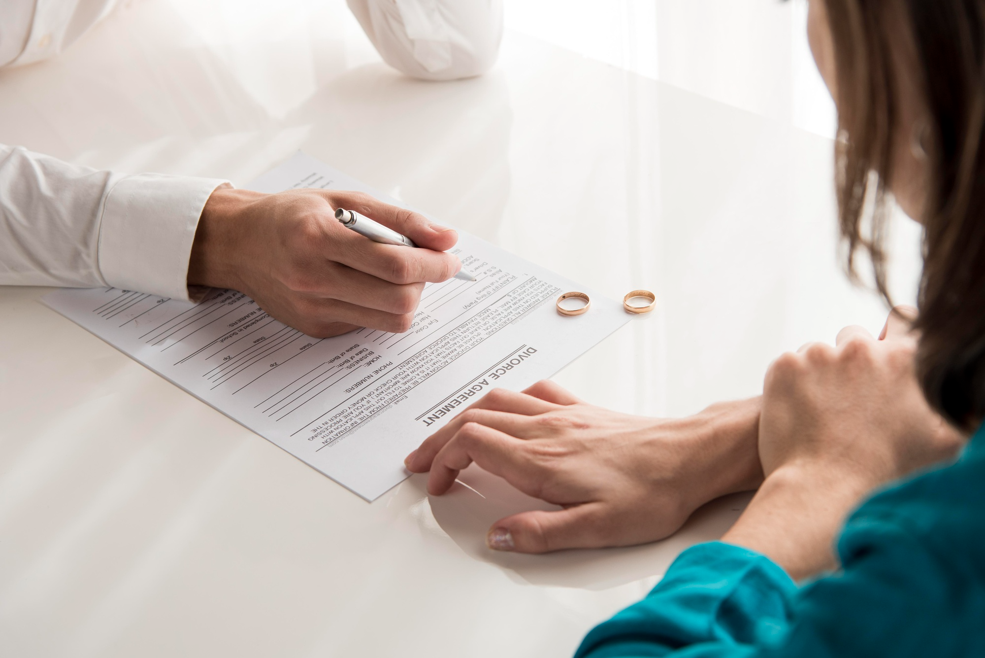 Lawyer guiding client through a divorce agreement with divorce lawyers in Houston