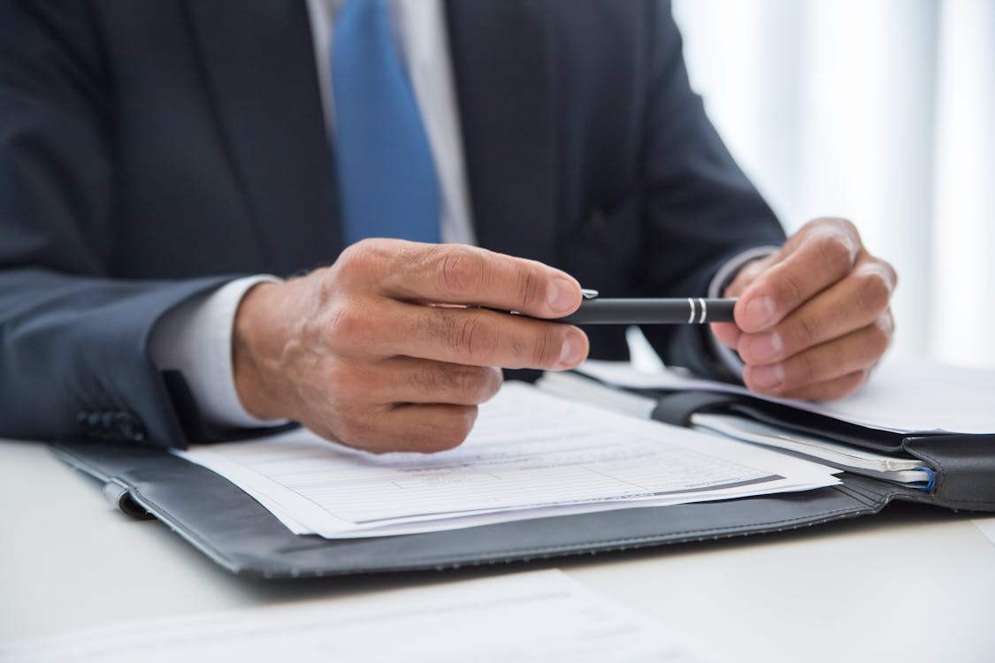 A lawyer reviewing papers during a CPS attorney in Houston consultation.