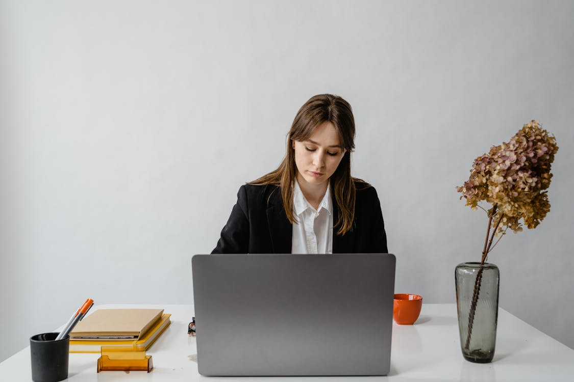 A woman reviewing documents while considering child support modification in Houston.