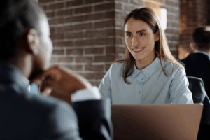 Woman discussing financial concerns with property division attorney in Houston.