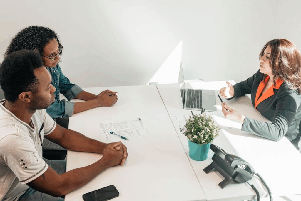 Couple consulting with a Houston family lawyer in an office setting.