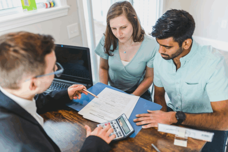 A couple sitting in front of a lawyer