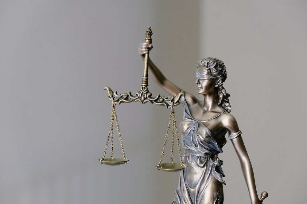 judicial figurine holding a balance