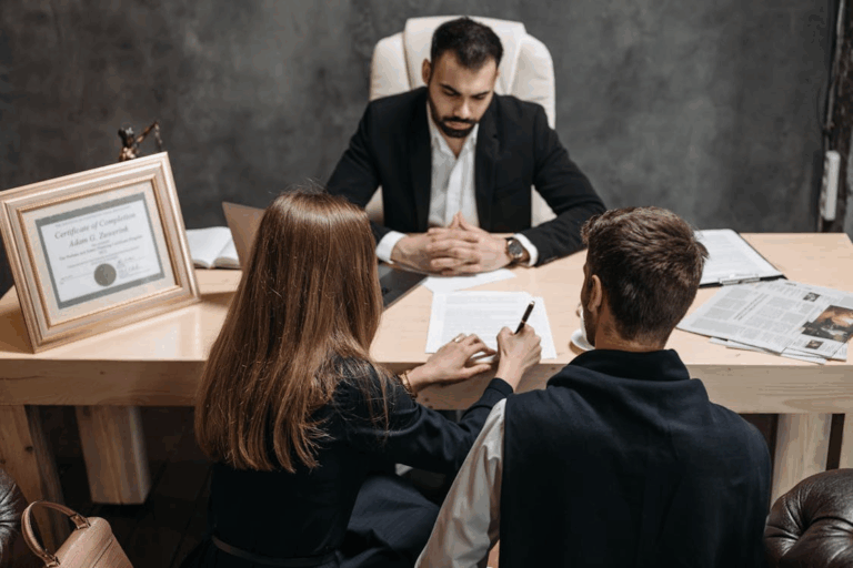 Client couple consulting with Houston divorce attorney about community property rules.