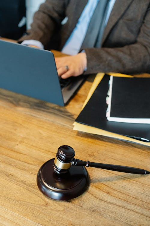https://images.pexels.com/photos/5668802/pexels-photo-5668802.jpeg Judge’s gavel on a desk at a Houston divorce law firm.
