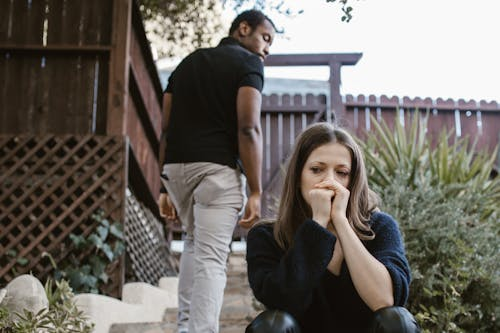 Man walking away from a sad partner