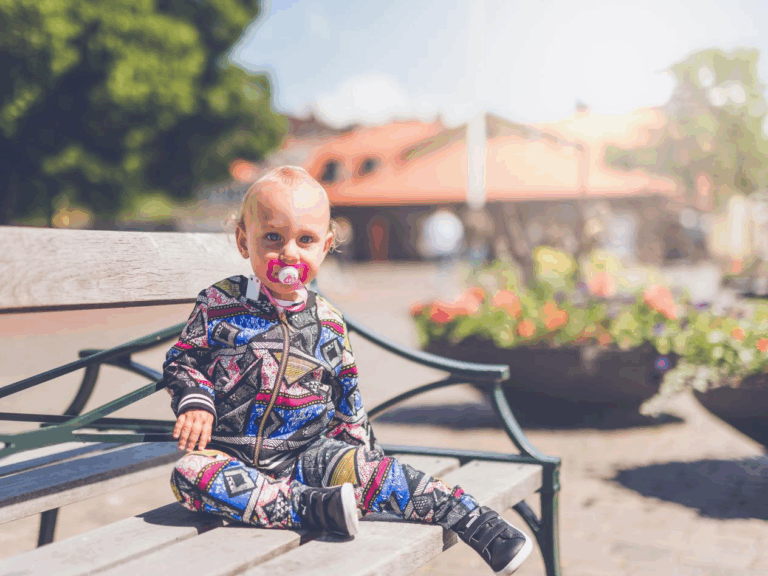A child sitting on a bench