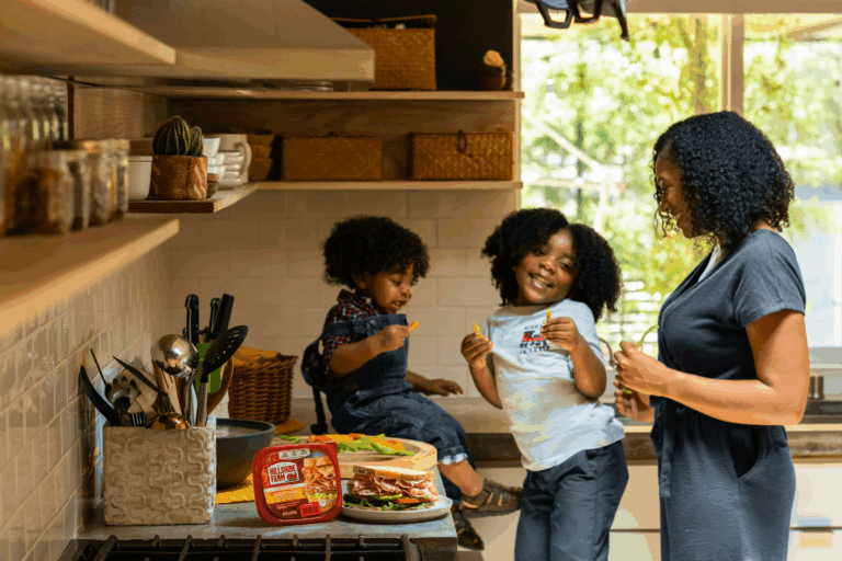 A woman and two children in a kitchen