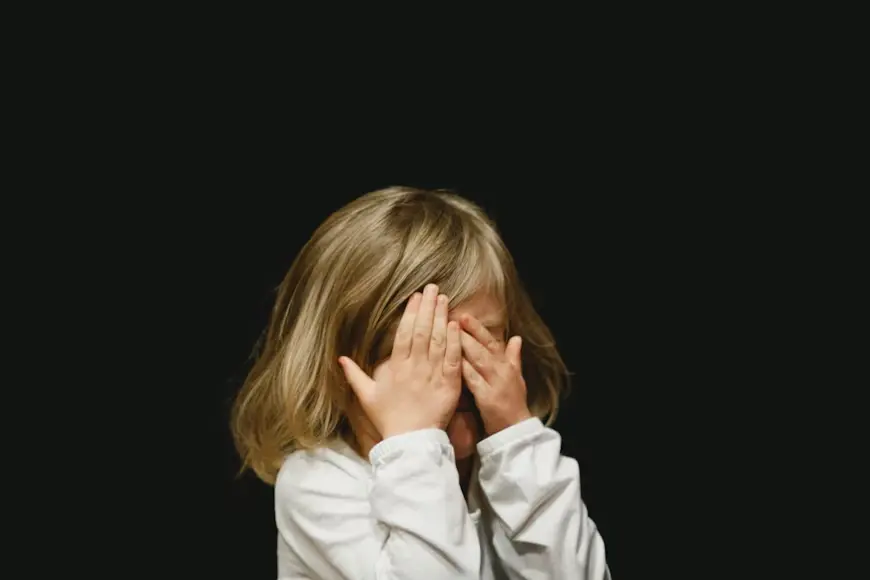 A child cries while feeling distressed.