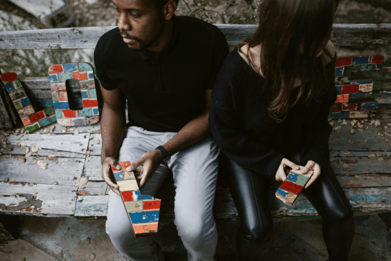 Two people sitting facing away from each other