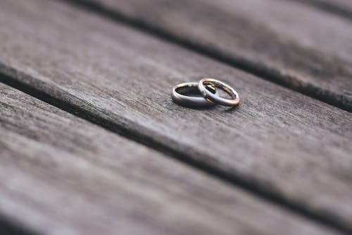A stack of wedding rings on a table.