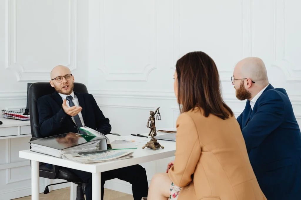 A couple at a lawyer’s office discussing their familial legal issue with guidance from a divorce lawyer in Southtown, San Antonio