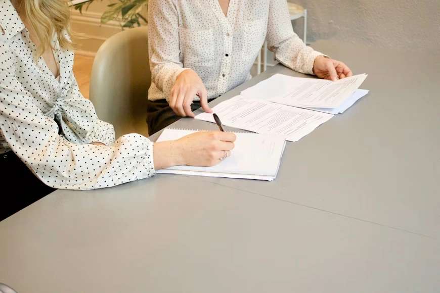 A client signs documents with an Amelia family law attorney.