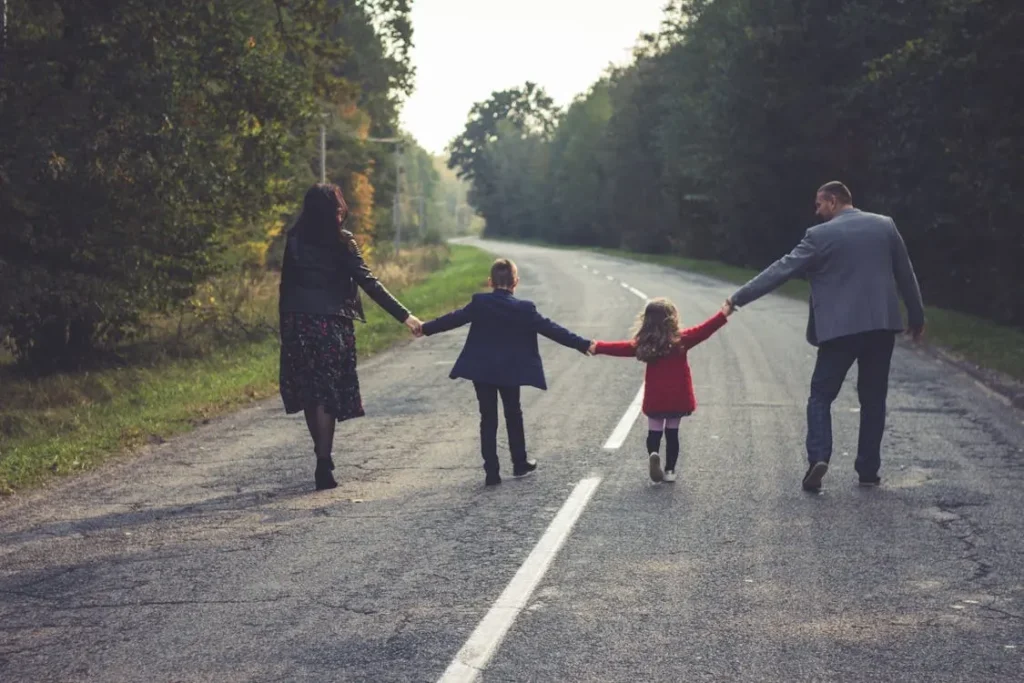 Parents walking with their child, representing the commitment of Silsbee CPS lawyers to protect family unity and defend parental rights during investigations.