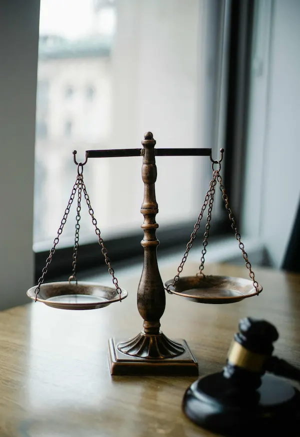 Scales of justice and a gavel on a table symbolizing family law cases in Pear Orchard, TX, handled by attorneys