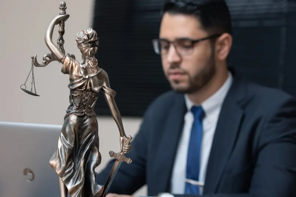 Scales of justice figurine on a lawyer’s desk representing an experienced divorce lawyer in Nederland, Texas