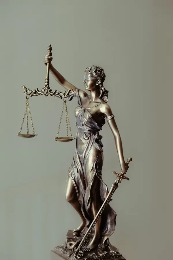 Scales of justice figurine representing fairness in divorce and custody cases in West End, TX