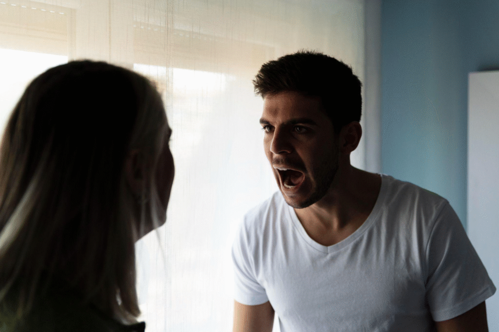 close-up of a man yelling at his partner