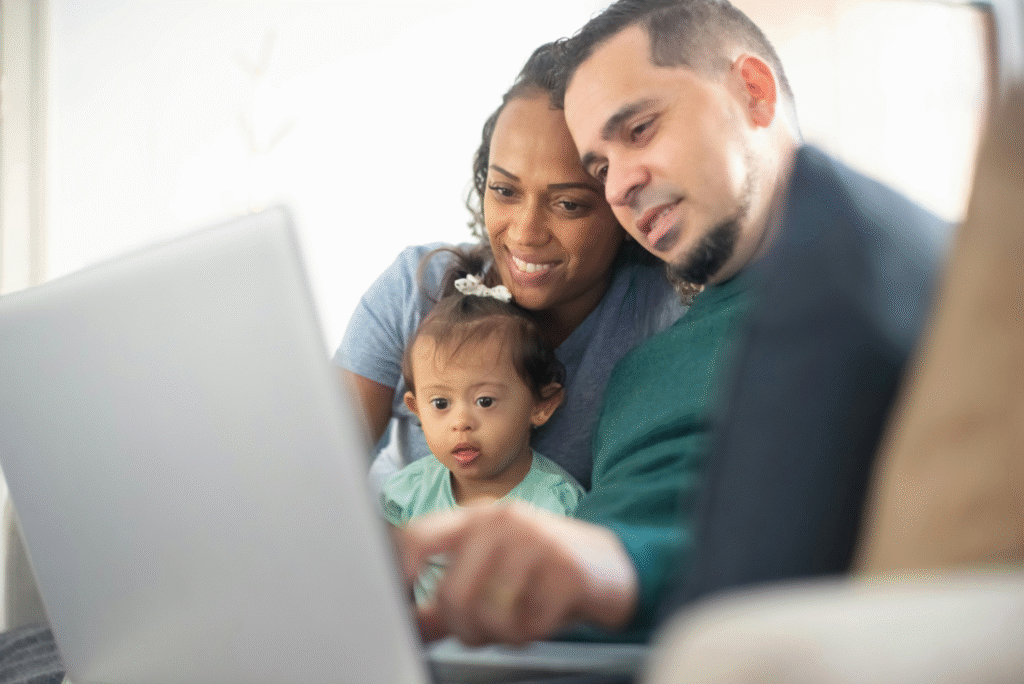 A family looking at a laptop