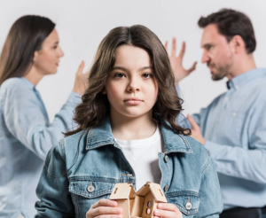 Couple fighting for child custody in front of their child.