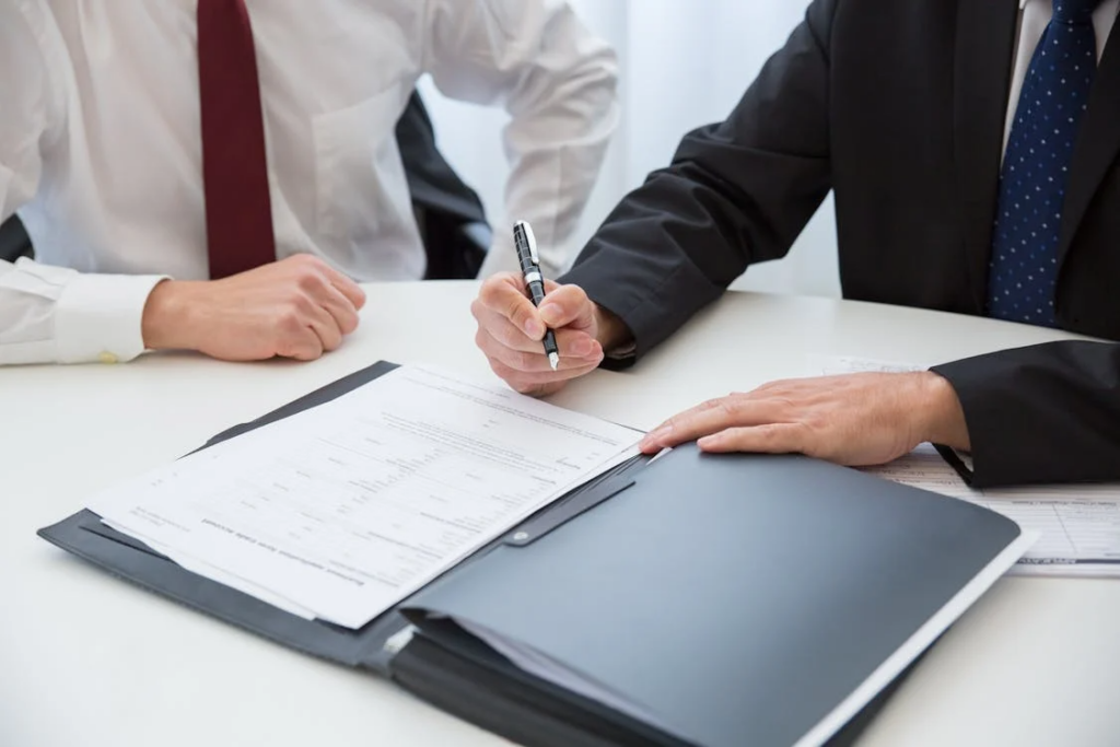 A lawyer reviewing papers during a CPS consultation in Houston
