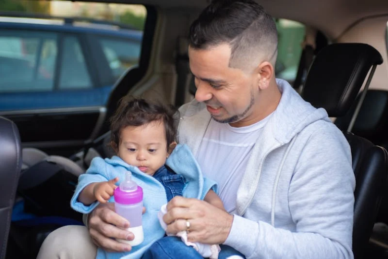 A father holding his daughter