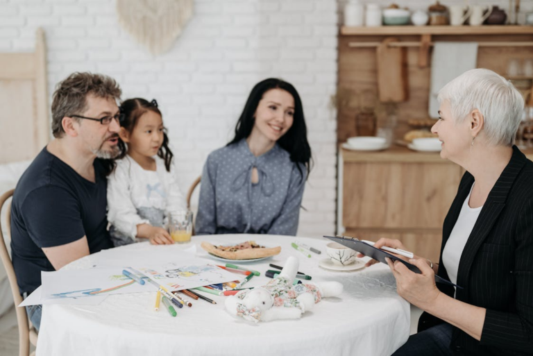 A family sitting at a table to support the interests of a child