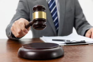 A person holding a gavel