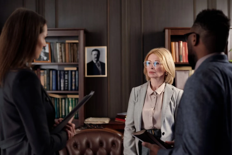 Family consulting with a lawyer in an office, discussing a CPS investigation