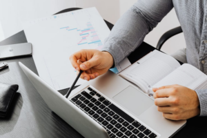 Person analyzing financial charts with guidance from a Texas property division attorney.