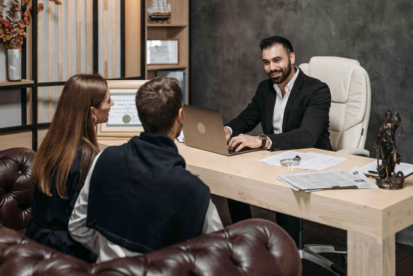 Couple discussing legal paperwork with a family law attorney in Texas