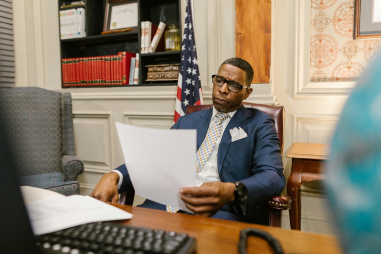 Attorney reviewing family court enforcement documents in a Houston office
