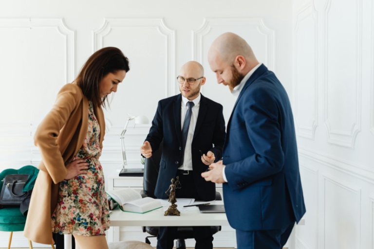 Houston divorce attorney reviewing property division documents with a client during a legal consultation