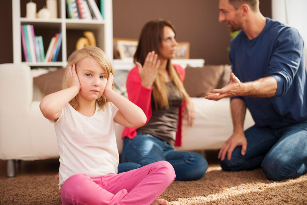 A couple arguing in front of their child